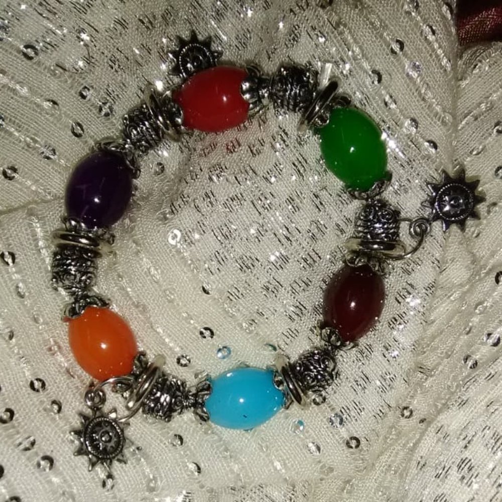 Colorful beaded bracelet with 3 sunshine charms